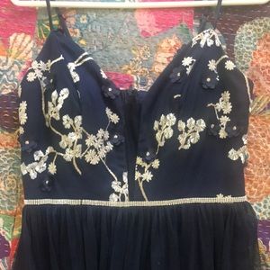 used prom dress, worn once! navy blue, floral top and gauzy bottom.